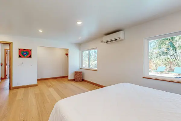 Reveals airy windows hardwood floors and comfortable sleeping space