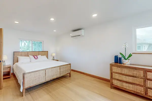 Second Bedroom features king bed dresser and soft natural window light