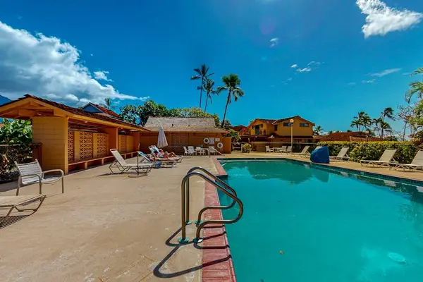 Cool off in the sparkling resort pool under sunny Hawaiian skies.
