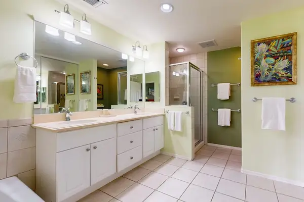 Large master bathroom with double sinks and a walk-in shower.
