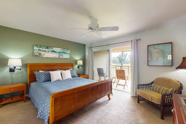 Master bedroom with king bed and private lanai access.