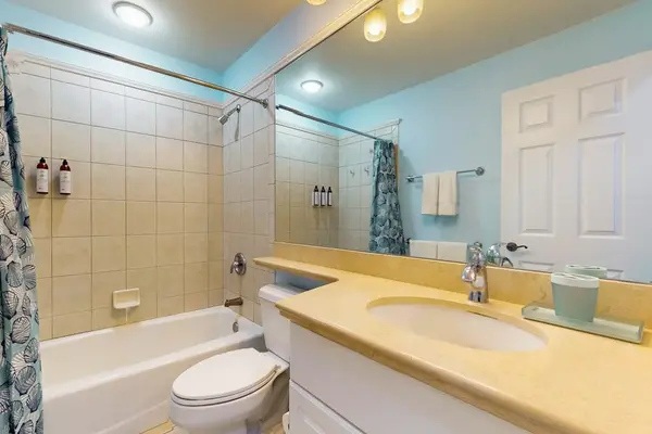 Guest bathroom with tub/shower combo.