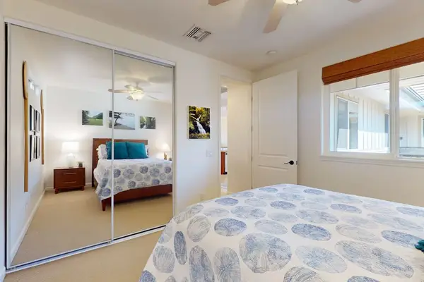 Guest Bedroom With Mirrored Closet
