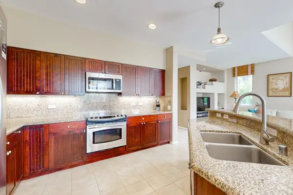 Kitchen features modern appliances generous counters and convenient meal preparation space