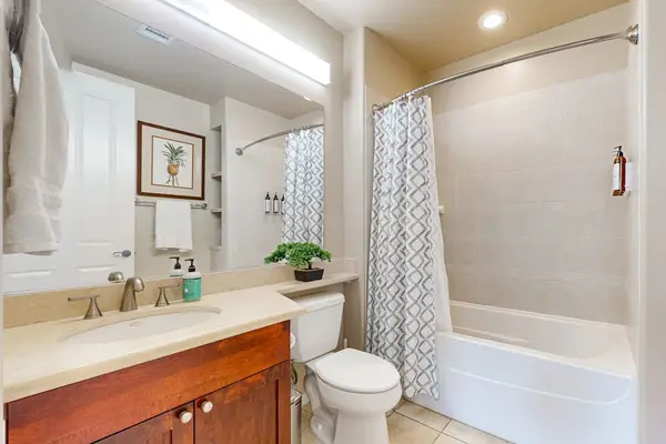 Bathroom provides vanity shower storage and bright natural light indoors