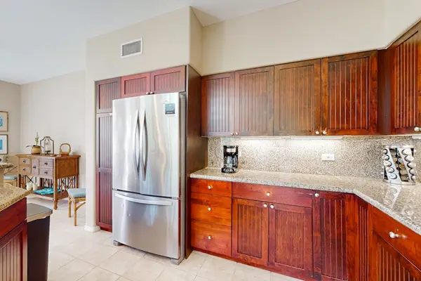 Kitchen cabinetry provides ample storage beside spacious preparation counters