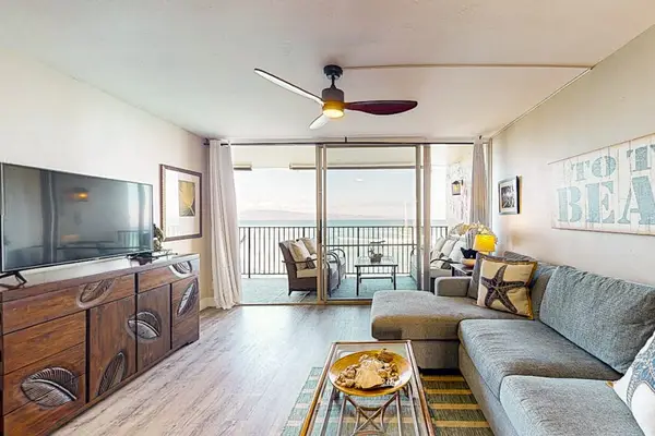 Living room with comfortable seating and flat screen tv great for a family movie night.