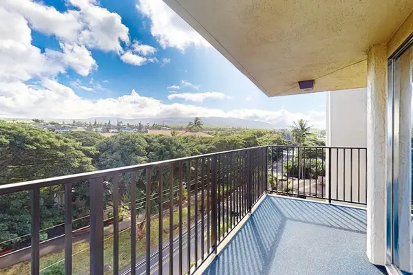 Walkway to the unit with tropical views.