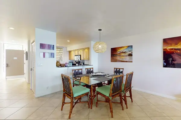 Open-Concept Dining Area with Seating for 6, Modern Lighting, and Scenic Wall Art