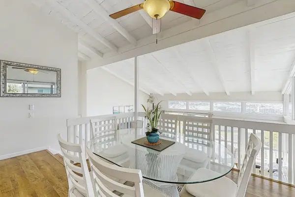 Enjoy comfortable meals in the dining area with a ceiling fan keeping the space cool.