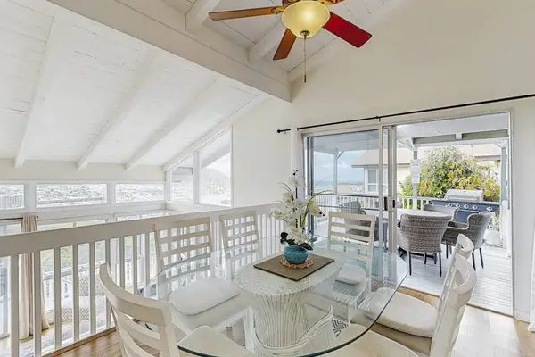 Share relaxed meals in this inviting dining area with overhead cooling.
