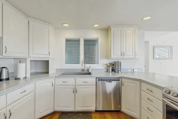 Prepare meals with ease in this fully equipped kitchen.