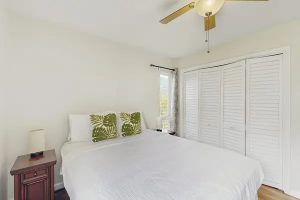Enjoy restful nights in the comfortable queen bed beneath the ceiling fan.