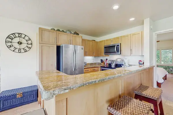 Bright cooking space provides organized storage, fixtures, and preparation room