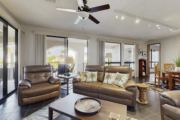 Stretch out on comfortable seating in this bright open-concept living area.