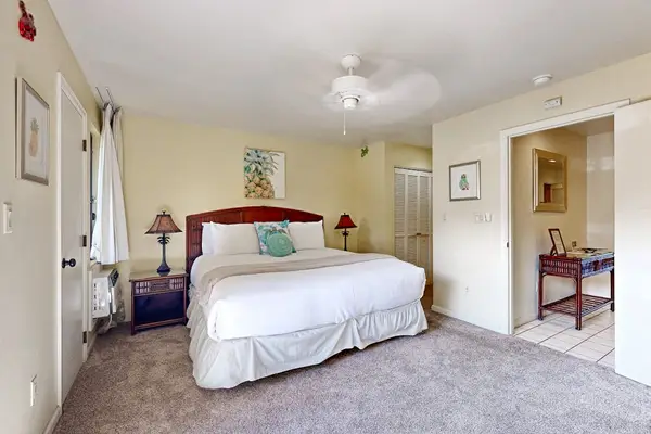 Restful bedding beneath bright ceilings and daylight