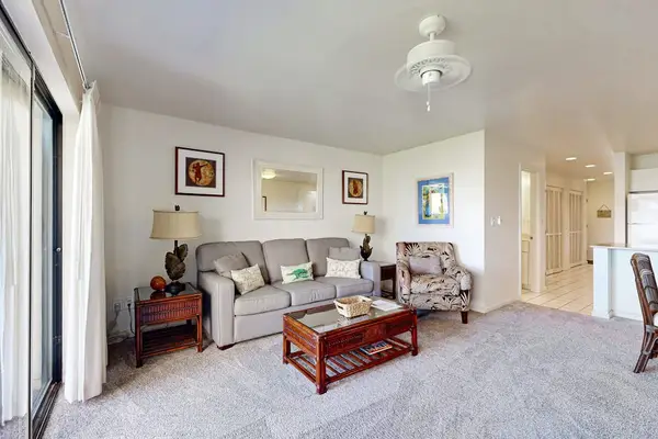 Soft couches and ocean-toned artwork create a welcoming gathering area