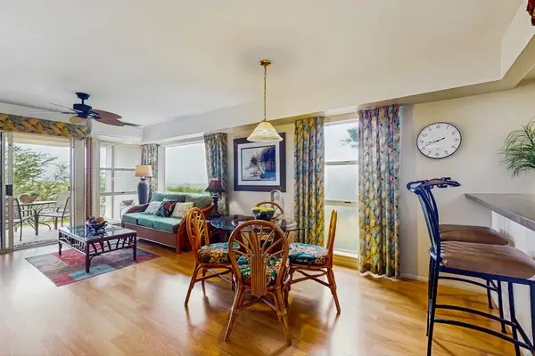 Comfortable living room with lanai access.