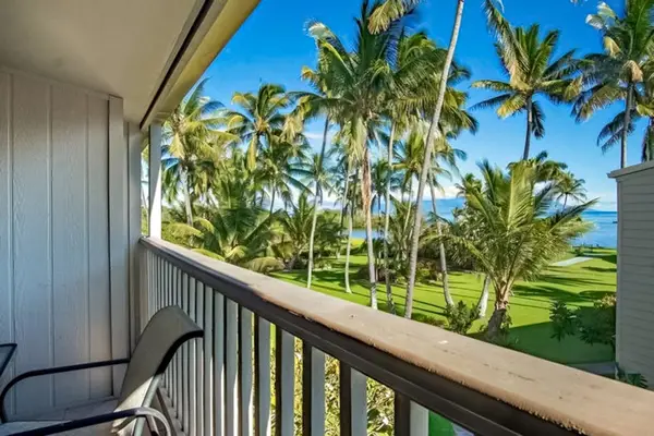 Balcony offers tropical views with comfortable seating overlooking resort grounds