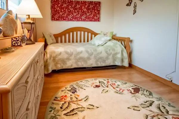 Enjoy restful nights in this cozy bedroom designed for comfort relaxation and peaceful stays