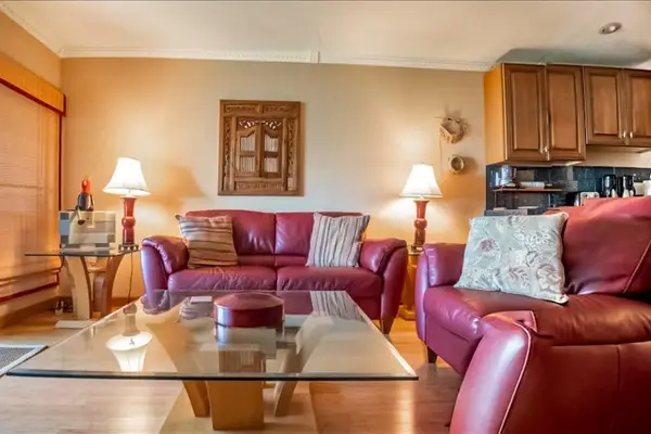 Living room offers seating television dining area and ceiling fan