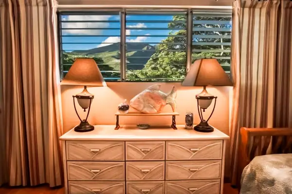 Spacious side table and drawers provide easy storage while maintaining a clean organized bedroom