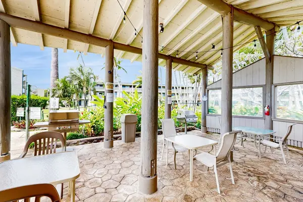 Resort BBQ area with picnic tables for memorable outdoor gatherings and meals