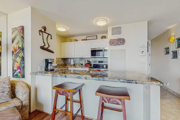 Two barstools for extra seating at the kitchen counter.