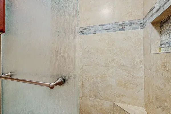 Remodeled master bathroom with large walk-in shower