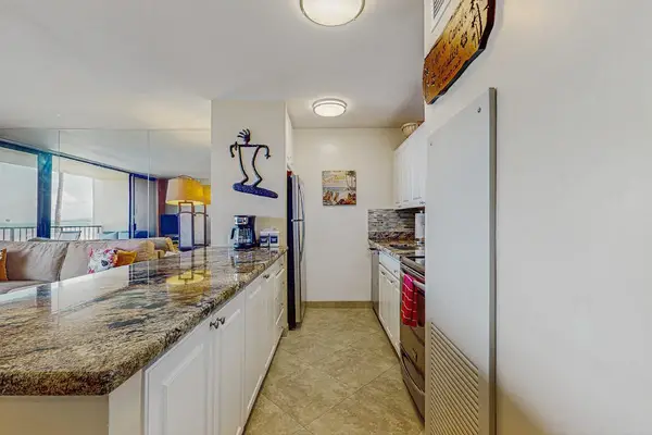 Fully remolded kitchen with stainless steel appliances.