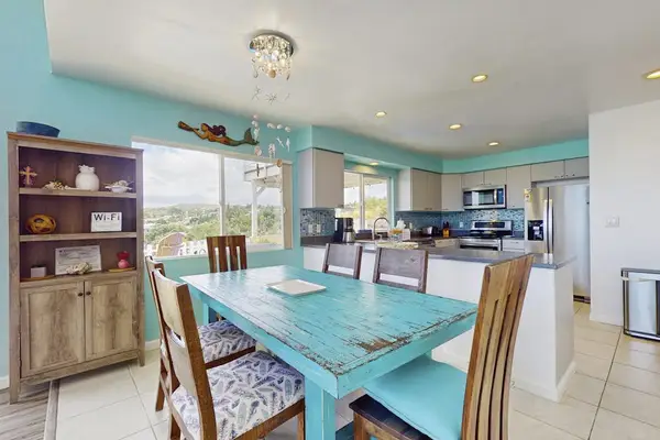 Dining room with seating for six.  Relax from the comfort of your home.