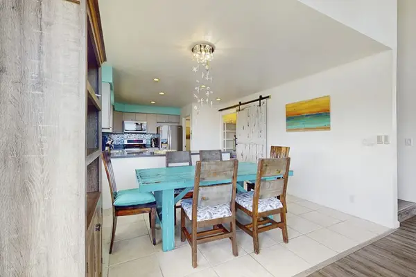 Dining room with seating for six.  Relax from the comfort of your home.