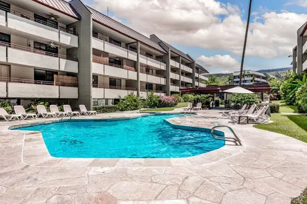 Sparkling Resort Pool Surrounded By Palms