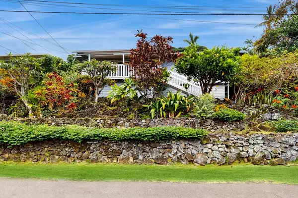 Landscaped exterior grounds surround the home with plants and pathways