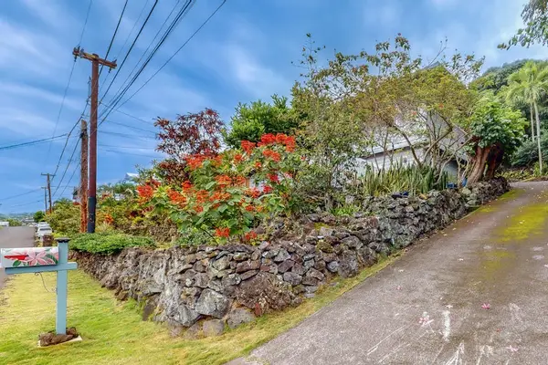 A peaceful garden walkway sets the tone for your perfect vacation stay