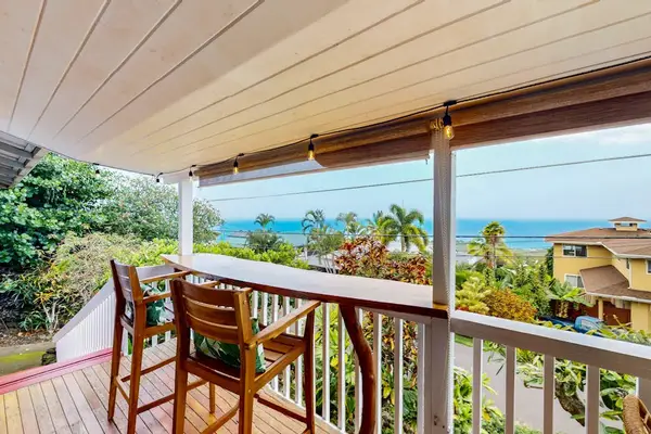 Covered balcony offers dining seating ocean views and tropical breezes