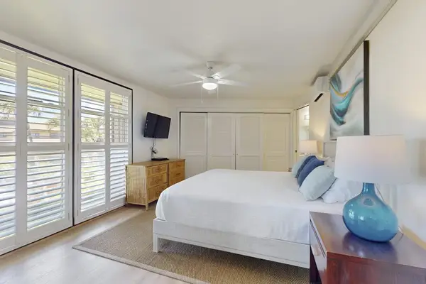 Peaceful Master Suite Featuring Breeze-Catching Plantation Shutters