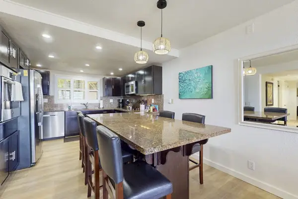 Massive Granite Breakfast Island Designed For Entertaining