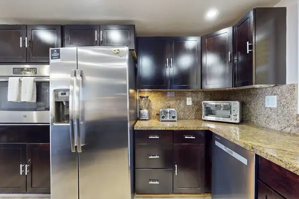 Premium Appliances And Granite Counters For Gourmet Meals