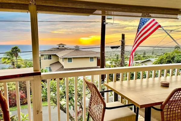 Overlooks tropical gardens with seating and ocean glimpses