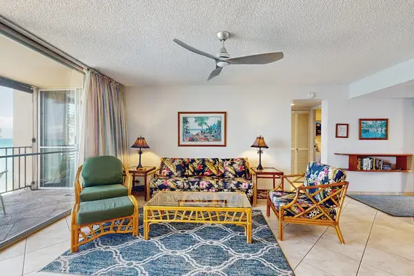 Gather in the comfortable living room with plenty of natural light and island-inspired décor.