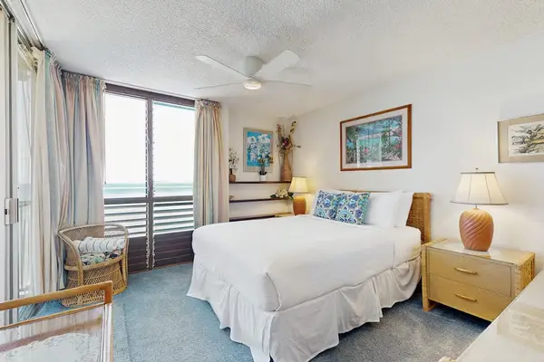Rest peacefully in the spacious king bedroom with easy access to the private lanai.