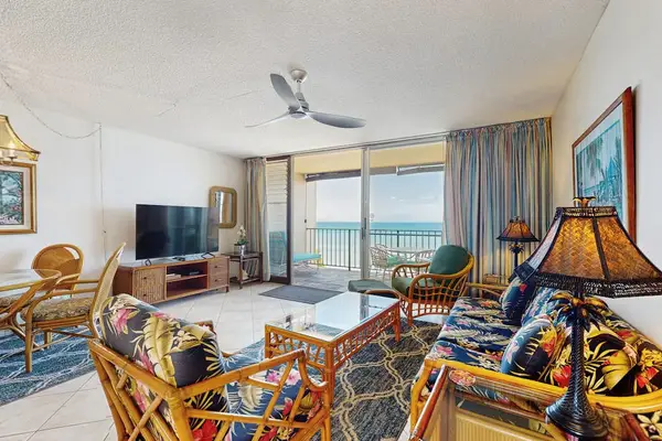 Relax in the inviting open-concept living room with beautiful ocean views just beyond the lanai.