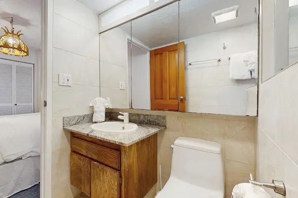 The full bathroom offers a spacious vanity and all the essentials for your stay.