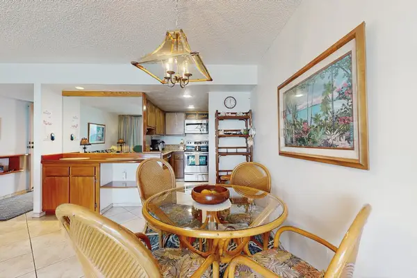 Share breakfast or dinner around the cozy dining table just steps from the fully equipped kitchen.