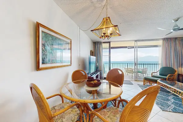 Gather around the dining table for memorable meals with a beautiful island backdrop.