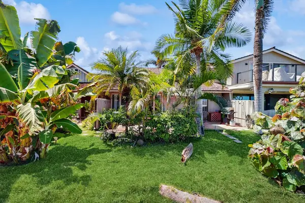 Lush tropical gardens create a peaceful outdoor retreat.