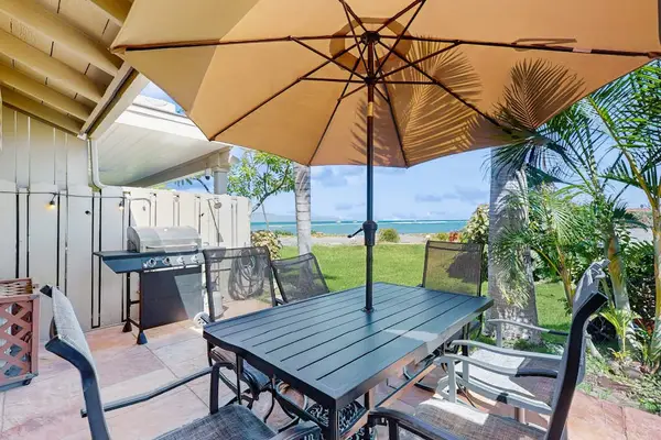 Enjoy outdoor dining on the private oceanfront patio with breathtaking island views.