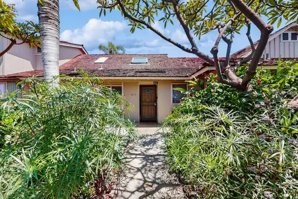 Follow the garden path to the inviting front entrance of the home.