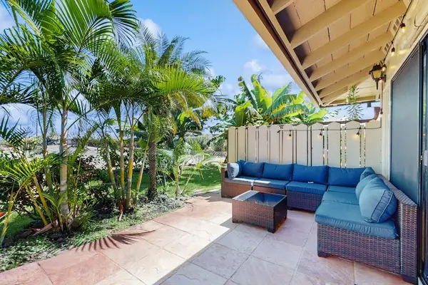 Enjoy outdoor lounging on your private patio surrounded by tropical gardens.